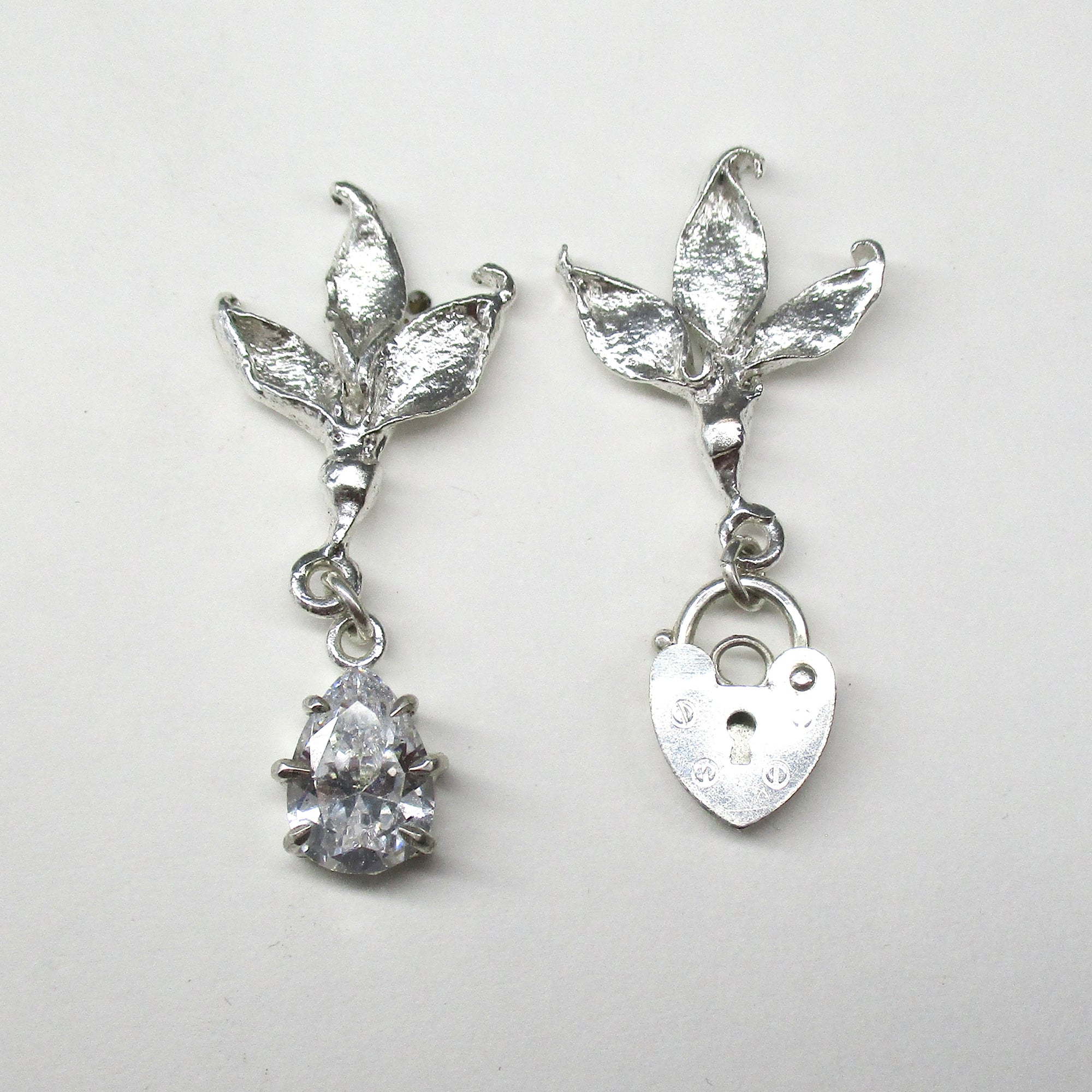 Two Birds One Stone Earrings in White Crystal